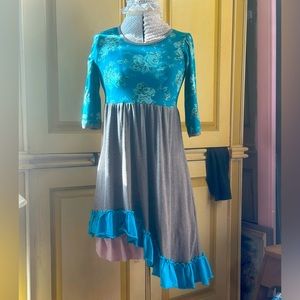 Girl’s teal ruffle top
